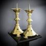A Pair of Gothic brass candlesticks 
