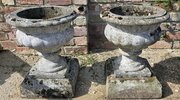 Pair Of 60s Weathered Urns On Plinths