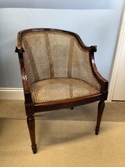 A Mahogany Caned Bergère Armchair