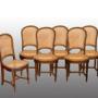 Group of six French walnut chairs. 19th century.