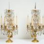 Pair of Girandoles in gilded bronze and crystal.