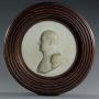 Marble plaque of Napoleon in reeded wooden frame