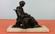 Bronze of a seated figure of girl with Bird