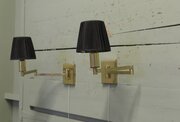 A Pair Of Brass Swing Arm Wall Lights