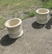 A Pair Of Round Garden Planters With Winged Cherub