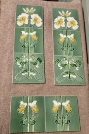 A Set Of 8 Art Nouveau Embossed Ceramic Tiles