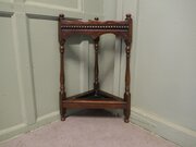 A Turned Oak Corner Stick And Umbrella Stand