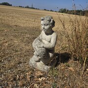 Pretty Well Weathered Stone Cherub Holding A Fish