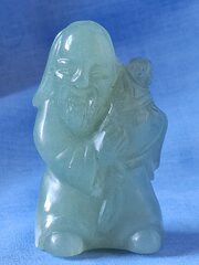 A Celadon Jade Figure Of A Sage