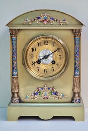 A Brass And Champleve Mantel Clock