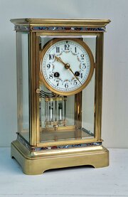 A Four Glass Mantel Clock With Enamel