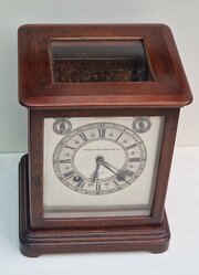 An Edwardian Oak Four Glass Mantel Clock