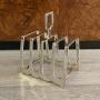 An Art Deco period arched silver Toast Rack