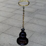 A Kenrick  Sons Brass and Cast Iron Doorstop