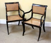 A Pair Of Regency Caned Armchairs