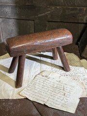 AN UNUSUAL DIMINUTIVE VERNACULAR STOOL C. 1800