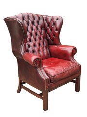 A Cosy George III Style Leather Winged Armchair