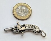 pocket watch chain fob in the form of a pistol Pocket watch chain fob in the form of a pistol