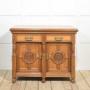 Carved oak two door sideboard by Maple and Co