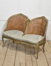 Painted And Parcel Gilt Caned Canape Settee