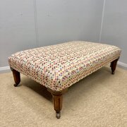 Large Geometric Upholstered Footstool On Castors