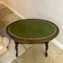 Antique walnut leather top oval writing table  Walnut leather top oval writing table
