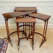 A Set Of Regency Rosewood Quartetto Tables