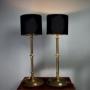 Pair Of Brass Table Lamps On Circular Bases.
