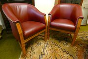 Pair of leather club chairs  tub chairs