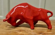 A Bright Red Cubist Sculpture Charging Bull