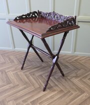 A Decoratively Carved Butlers Table, Tray On Stand