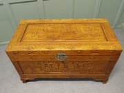A Large Honey Coloured Carved Oriental Chest