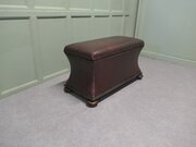 A Large Regency Waisted Leather Ottoman
