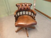A Leather Hide Swivelling Desk Chair Or Captains  