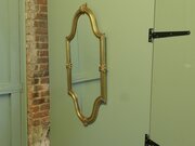 A Long Shaped Oval Brass Wall Mirror