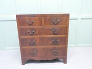 A Medium Size  Flame Mahogany Chest Of Drawers
