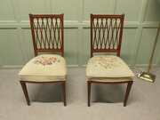 A Pair Of Arts And Crafts Walnut Hall Chairs