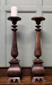 A Pair Of Tall Gothic Turned Carved Candlesticks