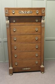 A Tall French Empire Walnut Chest Of Drawers  