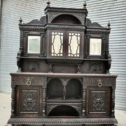 A Very Large Carved Oak Green Man Sideboard
