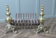An Elegant Pair Of Brass Andirons And Grate
