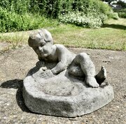 Garden Bird Bath With A Child Feeding The Birds
