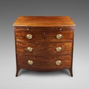 A George III Mahogany Bow-Fronted Chest Of Drawers
