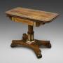 A Regency rosewood & brass inlaid card table