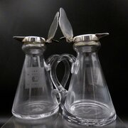 A Matched Pair Of 20thC Silver Capped Whisky Tots