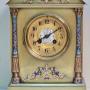 A Brass and Champleve Mantel Clock