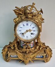 A Gilt Bronze Porcelain Panel Mantel Clock