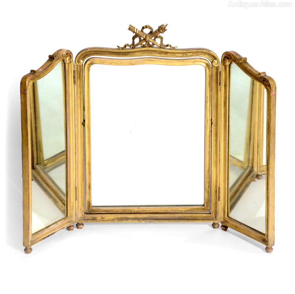 A Three Panel Folding Giltwood Mirror