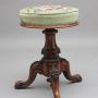 19th Century carved walnut piano stool