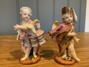 Pair Of Augustus Rex Figures Of "Cupid In Disguise"